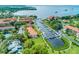 Aerial view of waterfront community with boat slips and lush landscaping at 1800 Mariner Dr # 3, Tarpon Springs, FL 34689