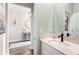 Guest bathroom with single sink vanity and modern fixtures at 21361 Snowy Orchid Ter, Land O Lakes, FL 34637
