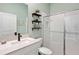 Modern bathroom with white subway tiles, floating vanity, and glass shower at 21361 Snowy Orchid Ter, Land O Lakes, FL 34637