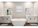 Spacious bathroom with double vanity, soaking tub, and walk-in shower at 21361 Snowy Orchid Ter, Land O Lakes, FL 34637