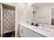 Clean bathroom with double vanity and shower/tub combo at 21361 Snowy Orchid Ter, Land O Lakes, FL 34637