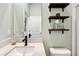 Clean bathroom with floating vanity and modern fixtures at 21361 Snowy Orchid Ter, Land O Lakes, FL 34637