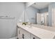 Simple bathroom with vanity and large mirror at 21361 Snowy Orchid Ter, Land O Lakes, FL 34637