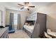 Cozy bedroom with a built-in bunk bed and a small table at 21361 Snowy Orchid Ter, Land O Lakes, FL 34637