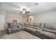 Spacious bonus room with large sectional sofa at 21361 Snowy Orchid Ter, Land O Lakes, FL 34637