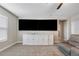 Bonus room with large TV and built-in cabinet at 21361 Snowy Orchid Ter, Land O Lakes, FL 34637