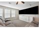 Bonus room features a large sectional sofa and TV at 21361 Snowy Orchid Ter, Land O Lakes, FL 34637