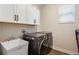 Laundry room with washer, dryer, and utility sink at 21361 Snowy Orchid Ter, Land O Lakes, FL 34637