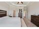 Main bedroom with king-size bed and ample closet space at 21361 Snowy Orchid Ter, Land O Lakes, FL 34637