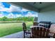Relaxing patio with seating area and built-in grill at 21361 Snowy Orchid Ter, Land O Lakes, FL 34637