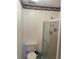Practical bathroom featuring a toilet, shower, and neutral tilework at 2280 Bancroft S Cir # A, Palm Harbor, FL 34683