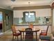 Dining area adjacent to the kitchen with a view into the kitchen at 2280 Bancroft S Cir # A, Palm Harbor, FL 34683