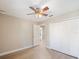 Spacious bedroom with ceiling fan and built-in closet at 29 Friendship Ct, Safety Harbor, FL 34695