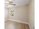 Bright bedroom with ceiling fan and large window at 29 Friendship Ct, Safety Harbor, FL 34695