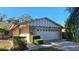 Attractive single-story home with a two-car garage and well-manicured landscaping at 3030 Bolt Dr, Palm Harbor, FL 34685