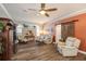 Living room boasts wood-look floors, a neutral color palette, and stylish furnishings at 3109 Ohara Dr, New Port Richey, FL 34655