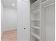 White built-in closet with shelves and hanging rod at 4551 Wilcox Ave, North Port, FL 34288