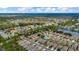 Aerial view of the neighborhood, showcasing the community layout, lakes, trees, and nearby amenities at 5021 Gato Del Sol Cir, Wesley Chapel, FL 33544