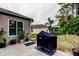 View of the backyard with an outdoor grill and view of the gazebo area at 5021 Gato Del Sol Cir, Wesley Chapel, FL 33544