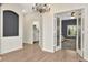 Entryway featuring modern lighting, neutral paint, and hard wood floors at 5021 Gato Del Sol Cir, Wesley Chapel, FL 33544
