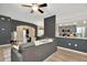Cozy living room with an open layout and a view of the adjacent kitchen at 5021 Gato Del Sol Cir, Wesley Chapel, FL 33544