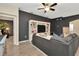 Comfortable living room with a built-in entertainment center and stylish decor at 5021 Gato Del Sol Cir, Wesley Chapel, FL 33544