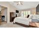 Bedroom with vaulted ceiling, two dressers, neutral carpet and a window with lots of natural light at 5021 Gato Del Sol Cir, Wesley Chapel, FL 33544