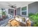 Relaxing front porch with wicker furniture and potted plants at 521 34Th N Ave, St Petersburg, FL 33704