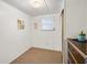 Small bedroom with window and closet; ideal for guests at 5212 Betmar Dr, Zephyrhills, FL 33542