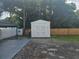 Storage shed in the backyard by a wooden fence at 5305 Rawls Rd, Tampa, FL 33625