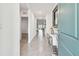 Bright and airy entryway with tile flooring and a modern console table at 6774 Shelby Lynn Way, Zephyrhills, FL 33542