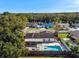 Aerial view showing home, pool, and surrounding neighborhood at 6550 Spanish Moss Cir, Tampa, FL 33625