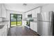 Modern kitchen with stainless steel appliances and granite countertops at 11105 Jenny Wren Rd, Weeki Wachee, FL 34614