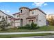 A beautiful home with a stone and stucco facade and a decorated entry at 13019 Paddock Wood Pl, Riverview, FL 33579