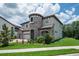 A two-story house features a turret, arched entryway, and a well-maintained green lawn at 13019 Paddock Wood Pl, Riverview, FL 33579