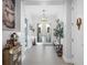 Bright foyer with tile floors, elegant lighting fixture, and decorative accents at 13019 Paddock Wood Pl, Riverview, FL 33579