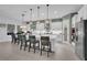 Bright, open kitchen featuring a large island, modern appliances, and pendant lighting at 13019 Paddock Wood Pl, Riverview, FL 33579