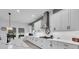 Modern kitchen featuring a center island with seating and stainless steel appliances at 13019 Paddock Wood Pl, Riverview, FL 33579