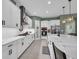 Elegant kitchen with white cabinets, stainless steel appliances, and a stylish island at 13019 Paddock Wood Pl, Riverview, FL 33579