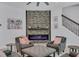 Cozy living room with stone fireplace, modern decor, and comfortable seating at 13019 Paddock Wood Pl, Riverview, FL 33579