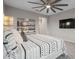 Relaxing main bedroom showcasing a decorative ceiling fan, a large bed and neutral colors at 13019 Paddock Wood Pl, Riverview, FL 33579