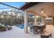 Covered patio with outdoor dining set next to a pool and spa at 13019 Paddock Wood Pl, Riverview, FL 33579