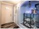 Entryway with decorative shelving and a coat closet at 13020 Sugar Creek Blvd, Hudson, FL 34669