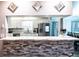 Kitchen features white cabinets, granite counters and stainless steel appliances at 13020 Sugar Creek Blvd, Hudson, FL 34669