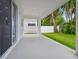Covered back patio overlooking fenced backyard at 1530 W River Shore Way, Tampa, FL 33603