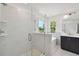 Modern bathroom with glass shower, soaking tub, and dark wood vanity at 1530 W River Shore Way, Tampa, FL 33603