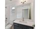 Clean and modern bathroom with dark vanity and white countertop at 1530 W River Shore Way, Tampa, FL 33603