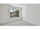 Bright bedroom with carpet flooring and large window at 1530 W River Shore Way, Tampa, FL 33603