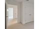 Bright, open bedroom with double doors and carpeted floors at 1530 W River Shore Way, Tampa, FL 33603