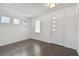 Entryway with white front door, dark wood floors, high ceilings, and multiple windows at 1530 W River Shore Way, Tampa, FL 33603